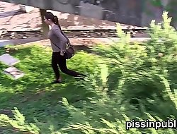 Desperate girls must pee in public parkland but realize caught on camera